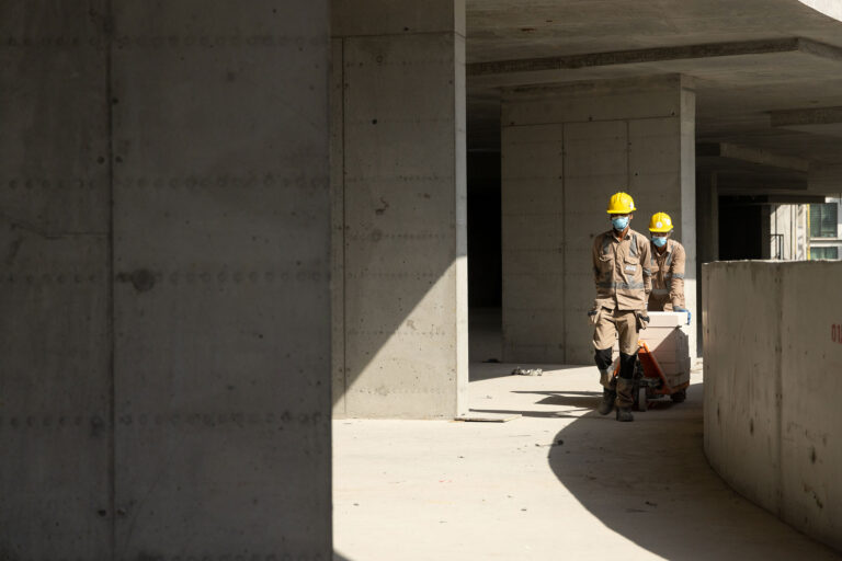 Workers working inside a construction site